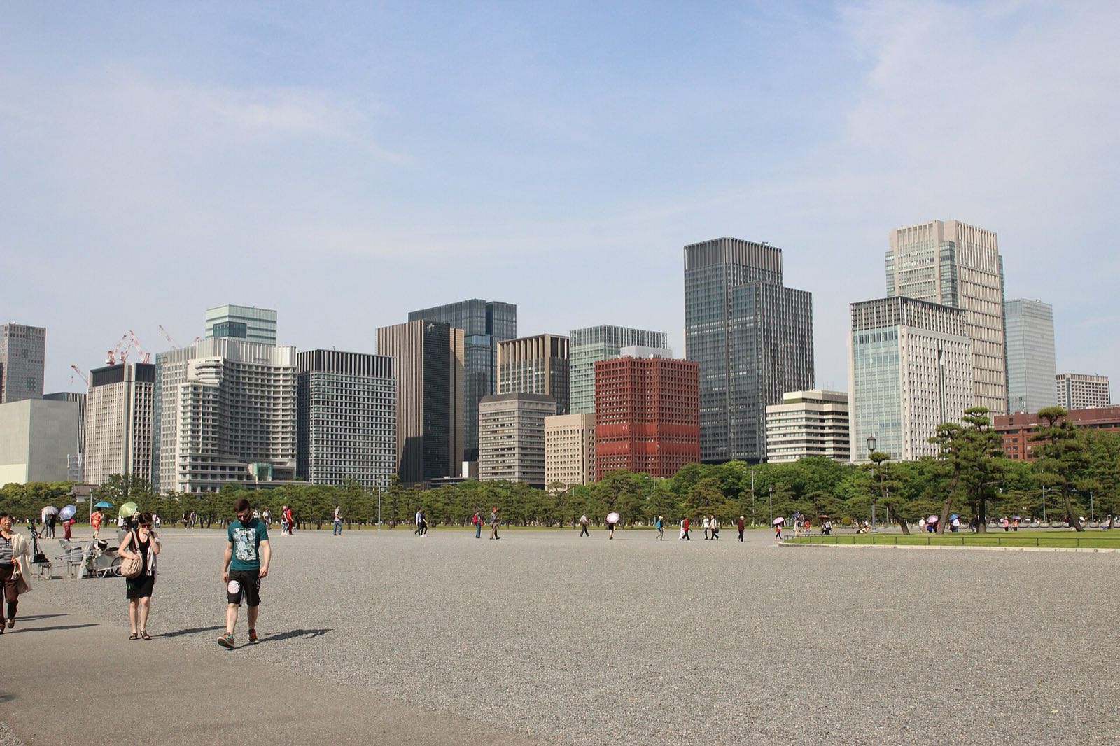 Office towers in central Tokyo, seen across the open plaza of the Imperial Palace.