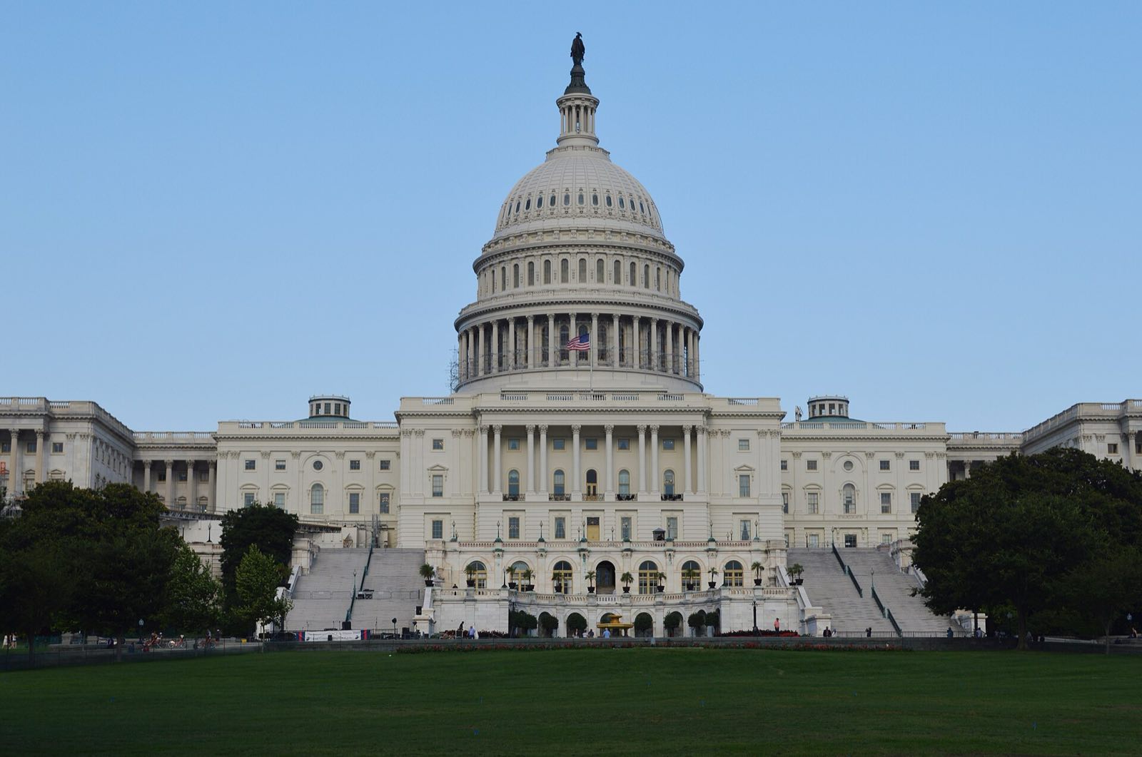 The dome of the United States Capitol in Washington under a clear sky.